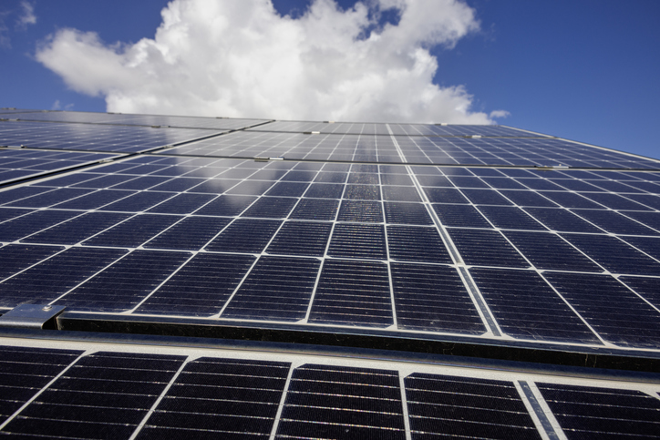 Solar panels with clouds in the background as a concept of renewable alternative solar energy.